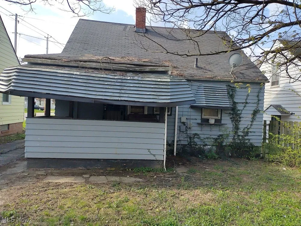Rear view of house with a chimney