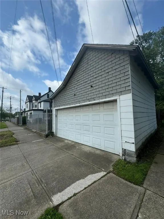 Garage featuring driveway