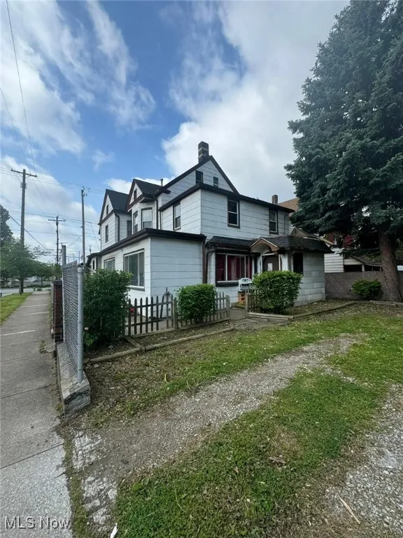 View of front of home with a chimney