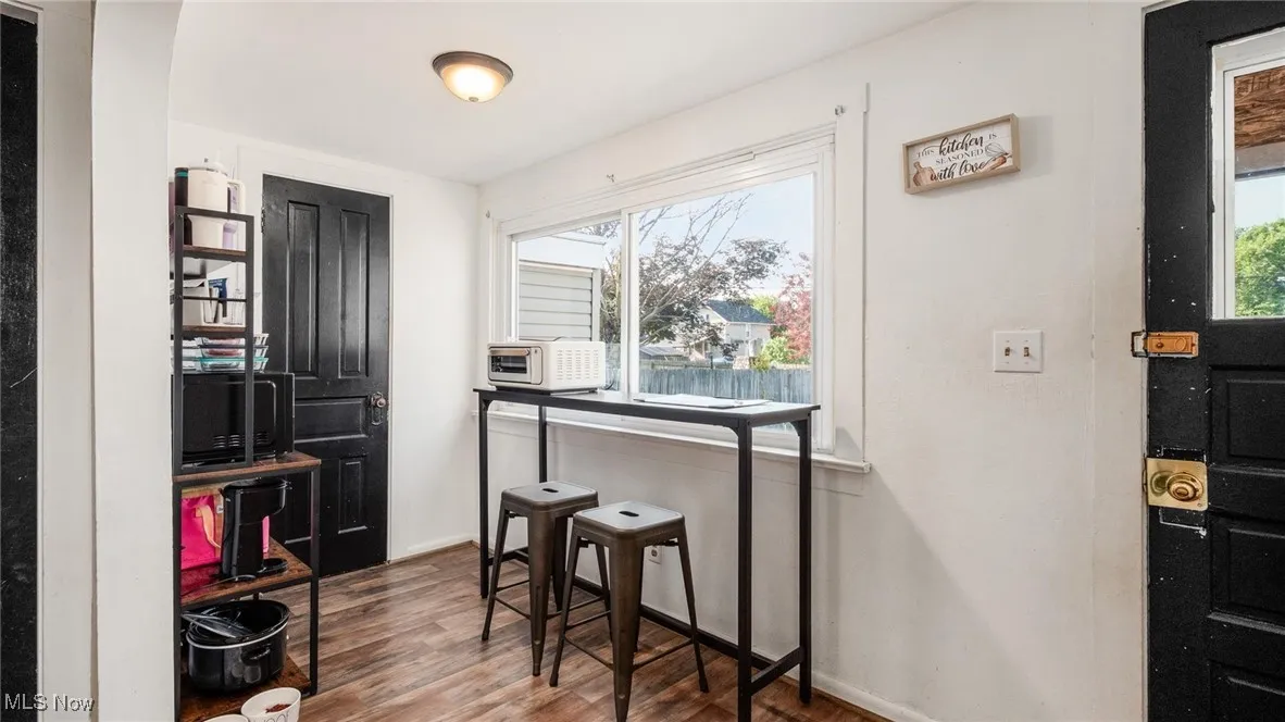 Dining area with wood finished floors and baseboards