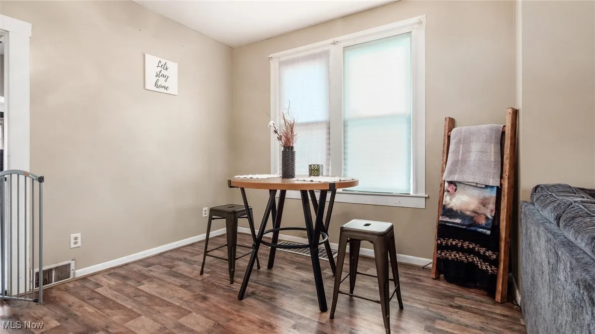 Dining room with wood finished floors and baseboards