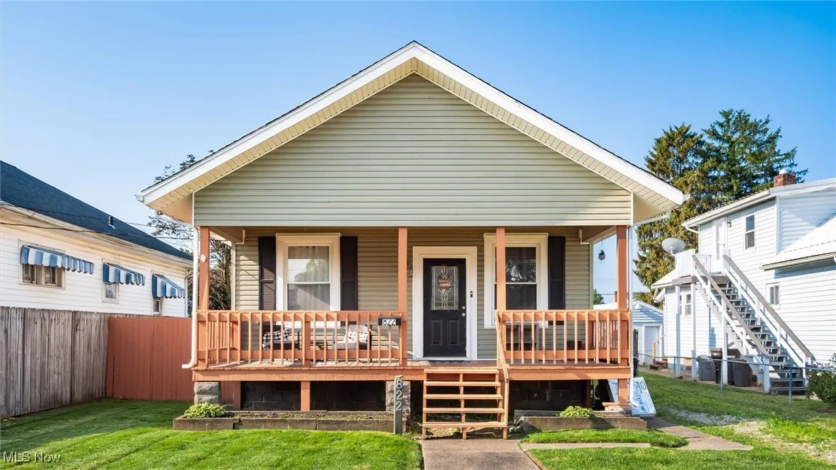View of front of house with covered porch and stairway