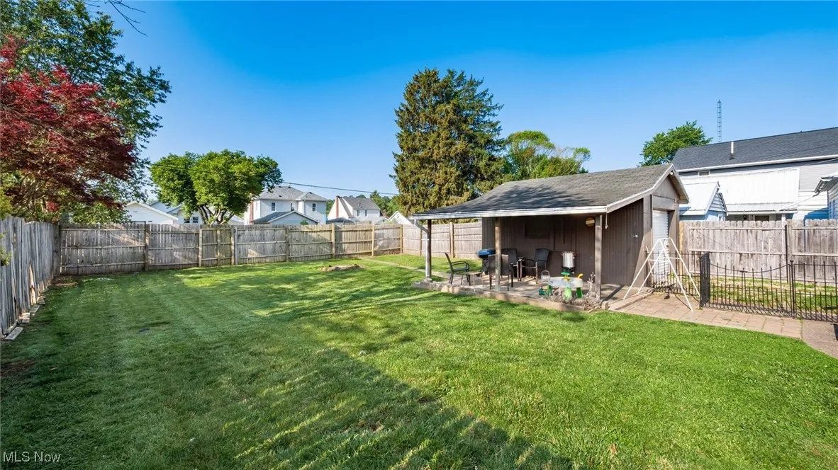View of yard with a patio area and a residential view