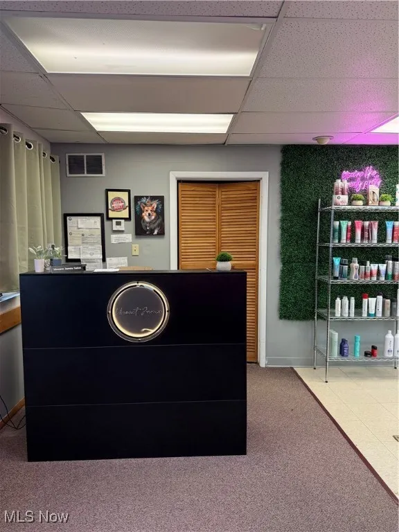 Reception area featuring a drop ceiling