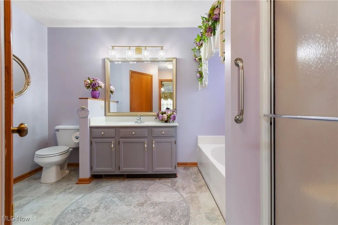Master bath has soaking tub, shower, and walk-in closet