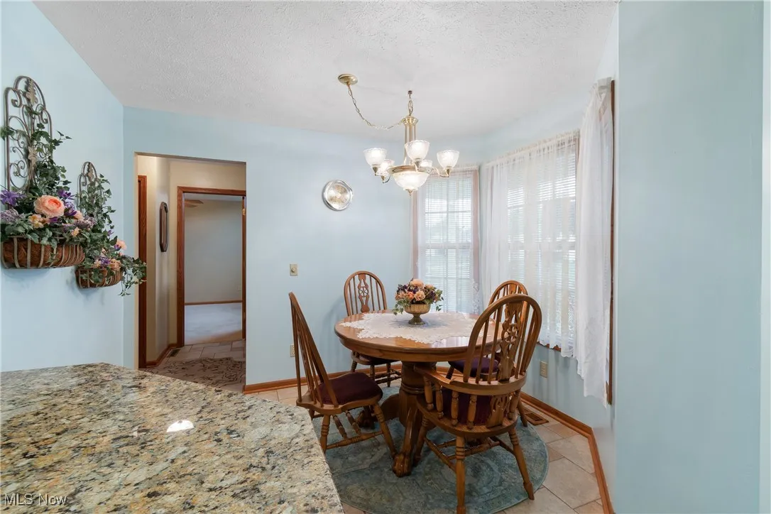 Dinette area is drenched in natural light.