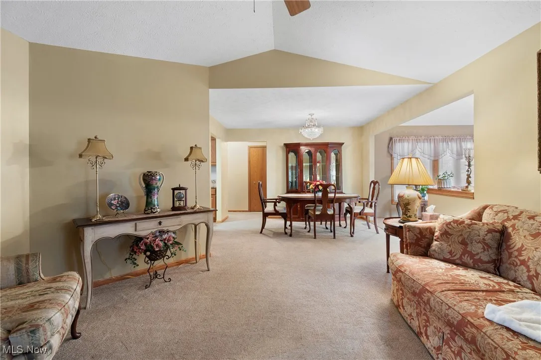Looking at other end of dining room and adjacent sun room