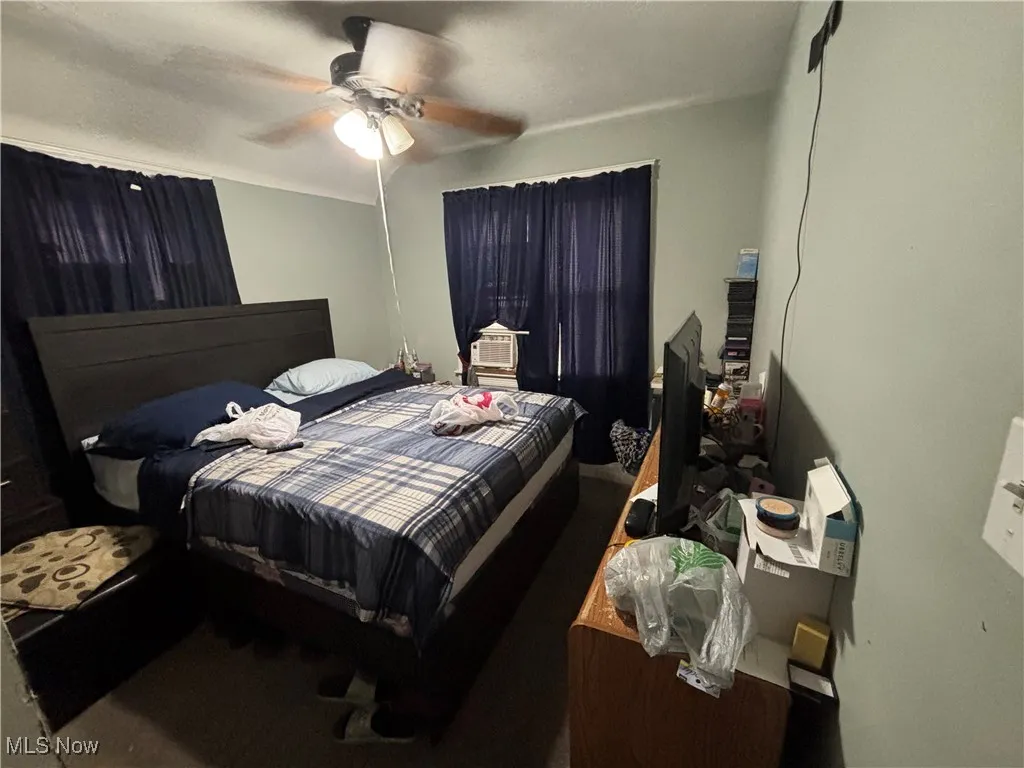 Bedroom featuring a ceiling fan