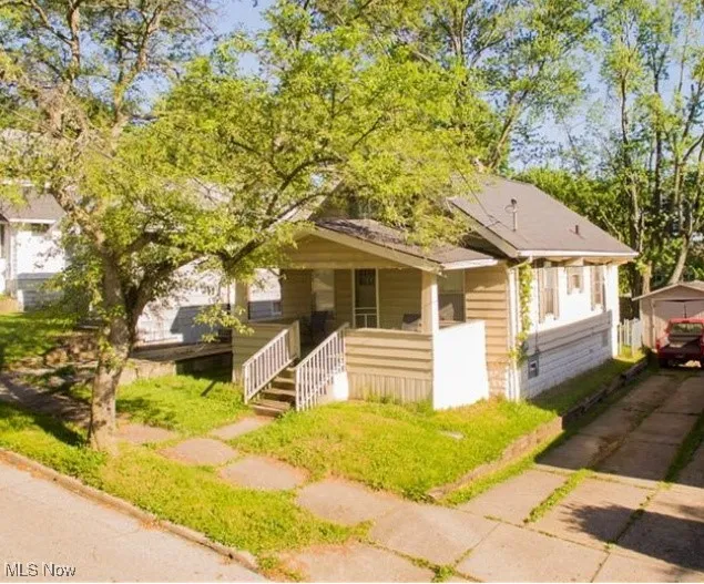 View of front of house with covered porch