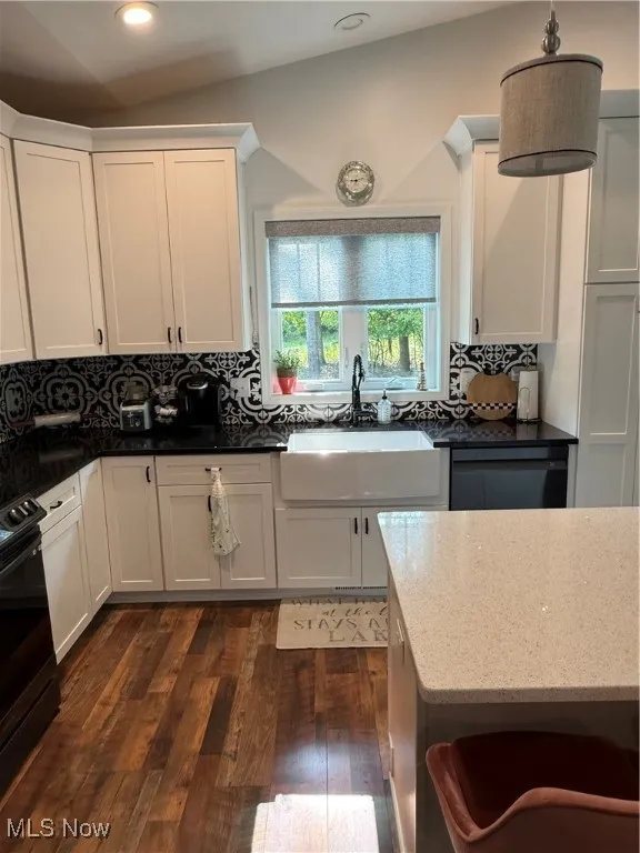 Kitchen with a farmhouse sink, custom blinds, backsplash, dark wood finished floors, and recessed lighting mixed with pendant lighting. All appliances stay.