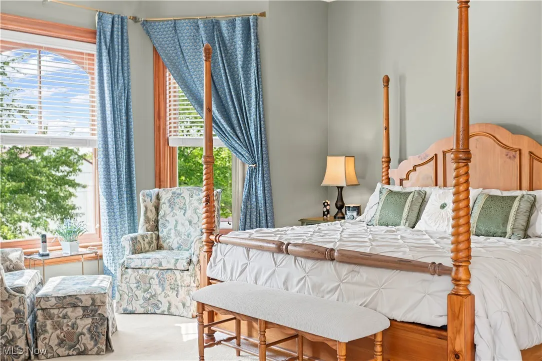 Bedroom featuring multiple windows