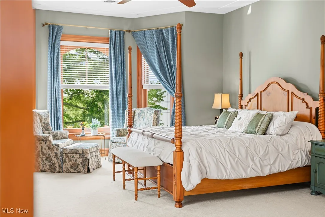 Carpeted bedroom with a ceiling​​‌​​​​‌​​‌‌​‌‌​​​‌‌​‌​‌​‌​​​‌​​ fan