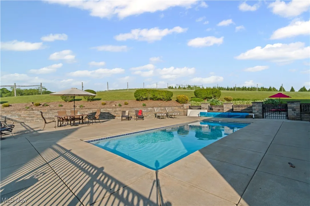 Outdoor pool with a patio