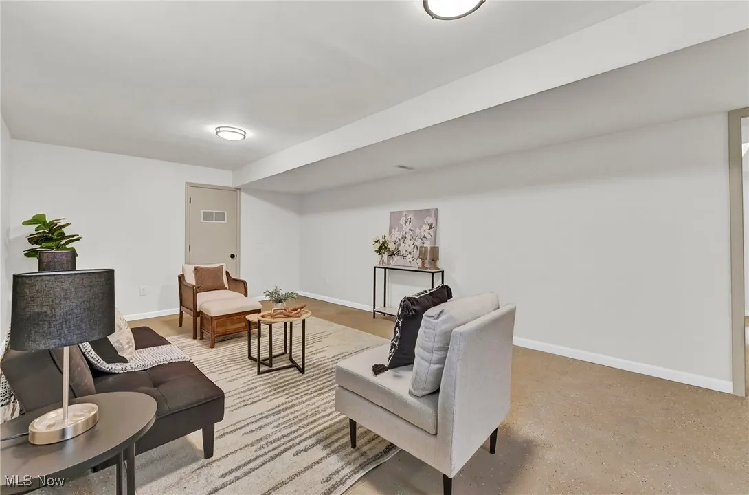 Living area featuring baseboards
