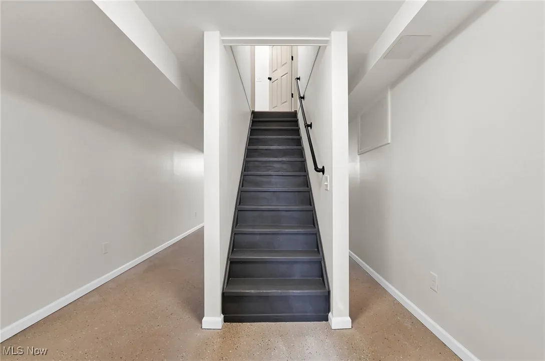 Stairs featuring baseboards