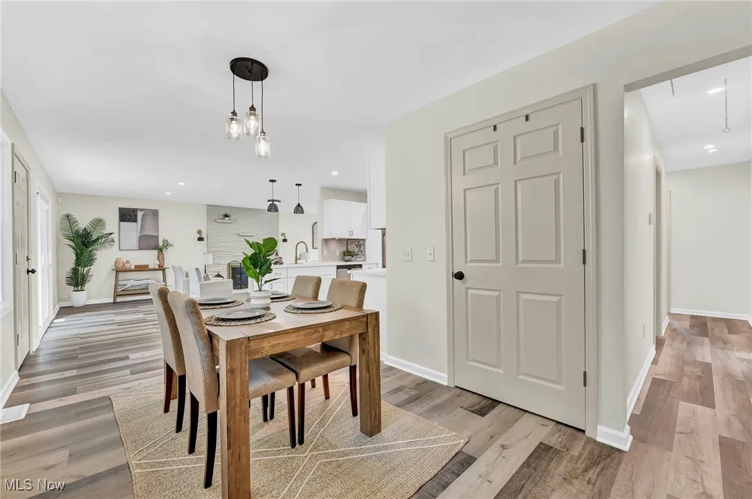 Dining space with light wood-style floors, baseboards, and recessed lighting