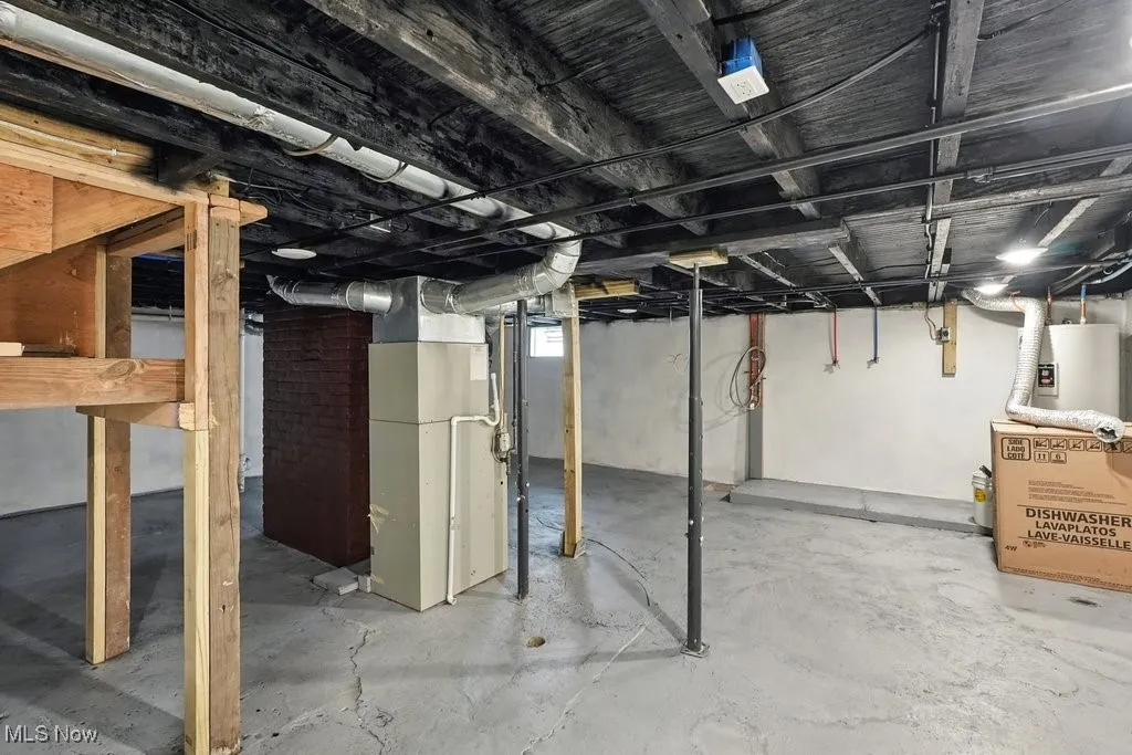 Below grade area featuring heating unit