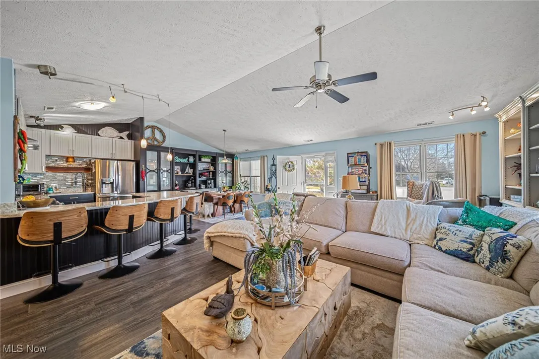 Vaulted great room opens into the custom kitchen and beautiful dining room!