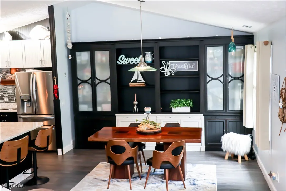Open dining room into the kitchen & is spacious enough to handle many different arrangements!