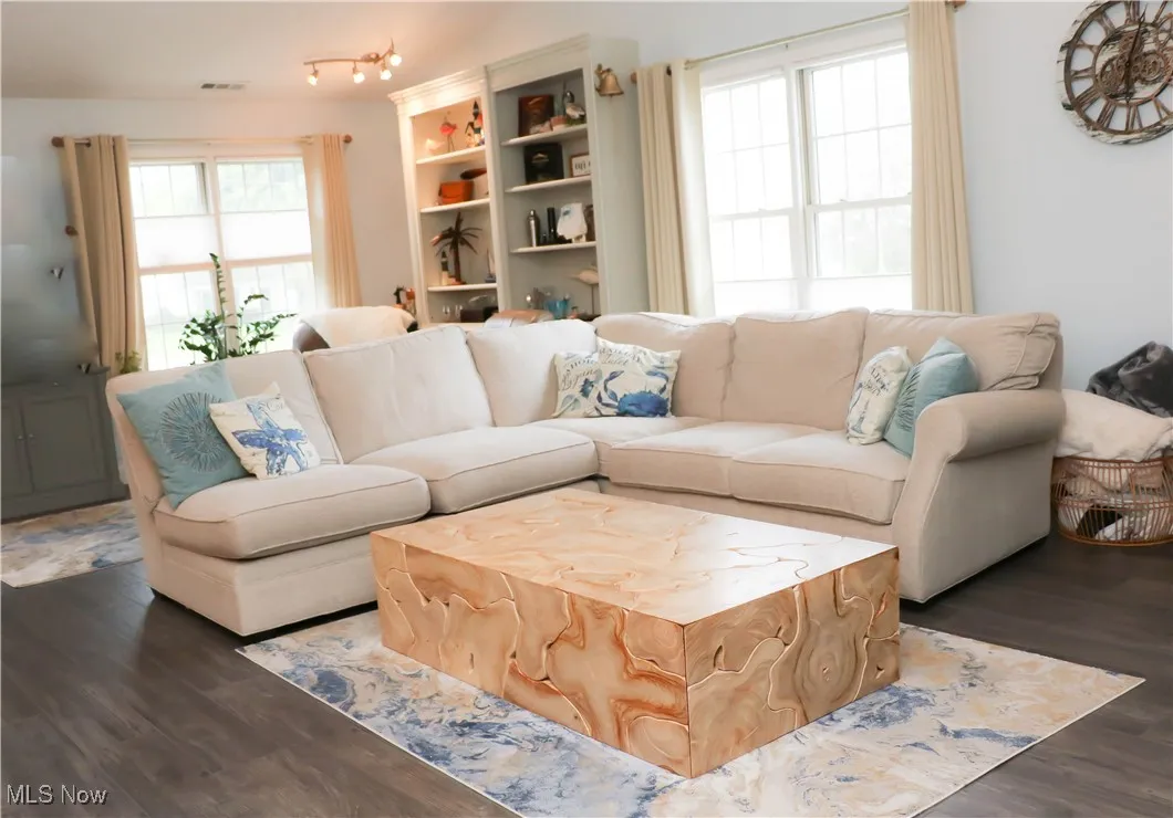 Spacious great room is vaulted, open & inviting with a beautiful gas fireplace into the second sitting area!