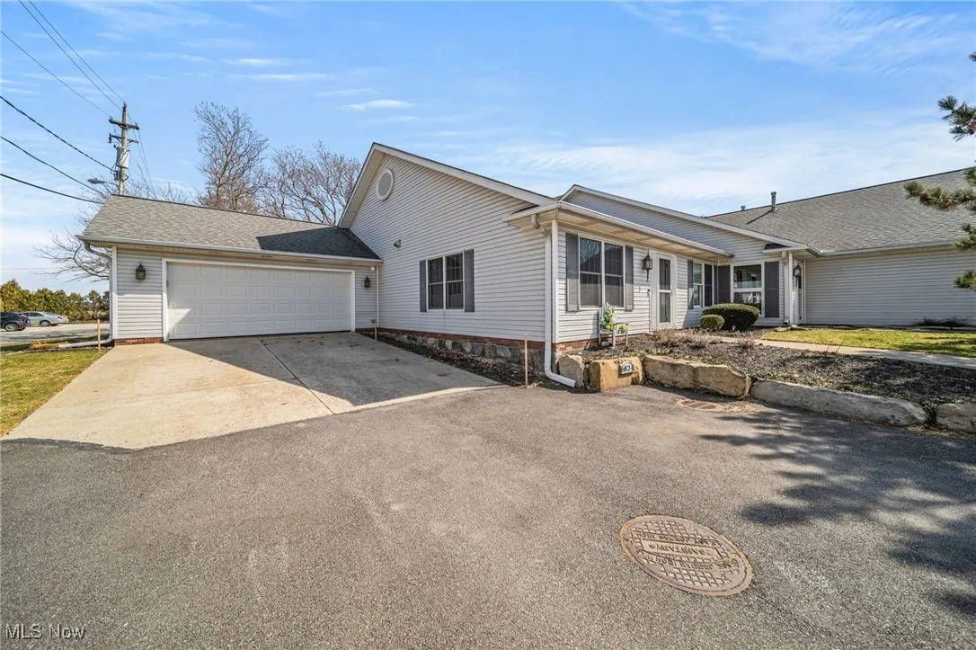 Front od this stunning, completely remodeled condo with attached two car garage!  Notice the long driveway that can accommodate extra parking!
