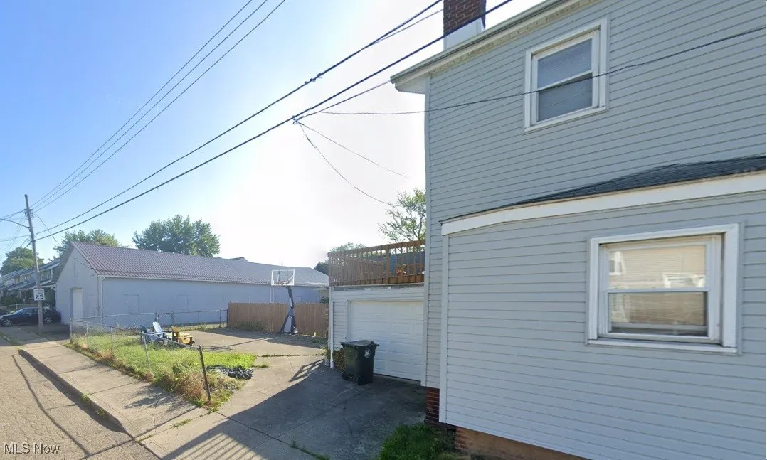 View of property exterior with a garage