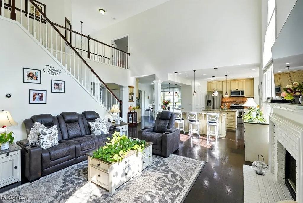 Great Room with Fireplace, Window Treatment, Gorgeous Large Window that Flanks Both Sides of Fireplace, and Two Story Ceiling Height