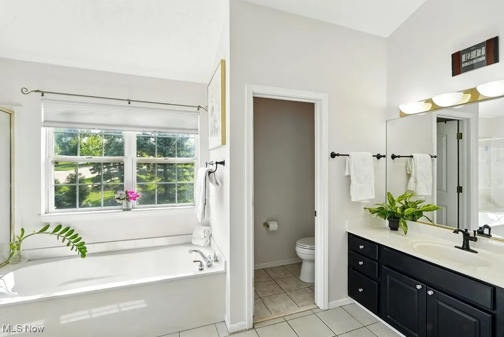 Master Bathroom with Two Separate  Closets, Separate Walk-In shower, and Soaking Tub