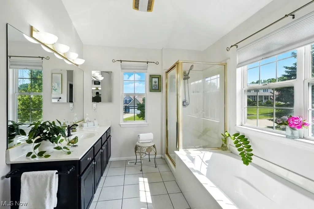 Master Bathroom with Two Separate  Closets, Separate Walk-In shower, and Soaking Tub