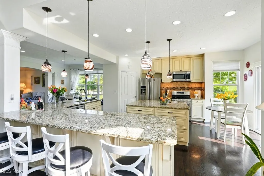 Kitchen with Granite Countertops, Large island, Updated Appliances, and 2 Pantries