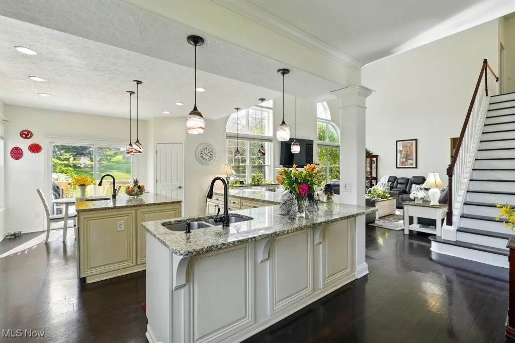 Kitchen with Granite Countertops, Large island, Updated Appliances, and 2 Pantries