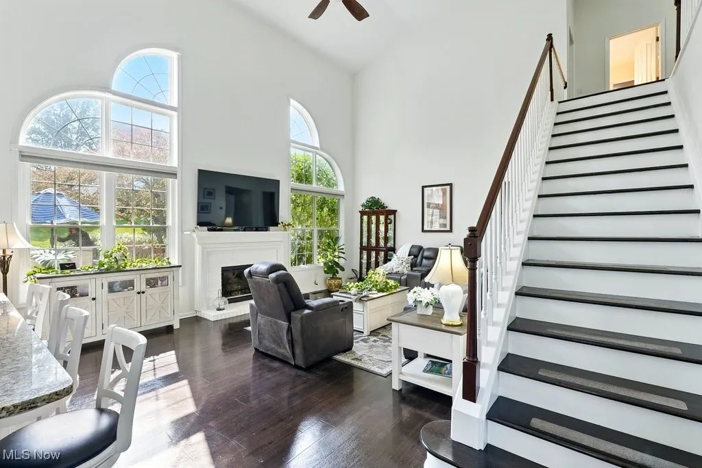 Great Room with Fireplace, Window Treatment, Gorgeous Large Window that Flanks Both Sides of Fireplace, and Two Story Ceiling Height