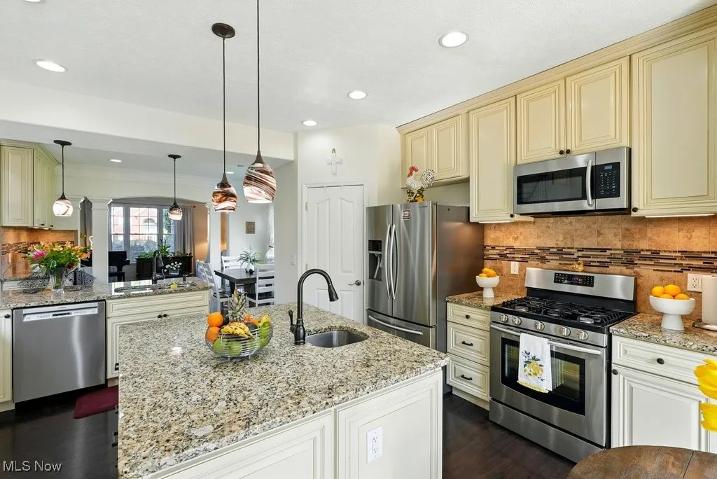 Kitchen with Granite Countertops, Large island, Updated Appliances, and 2 Pantries