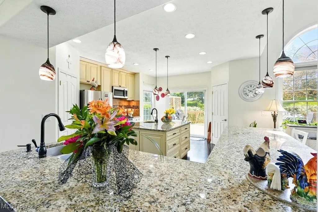 Kitchen with Granite Countertops, Large island, Updated Appliances, and 2 Pantries