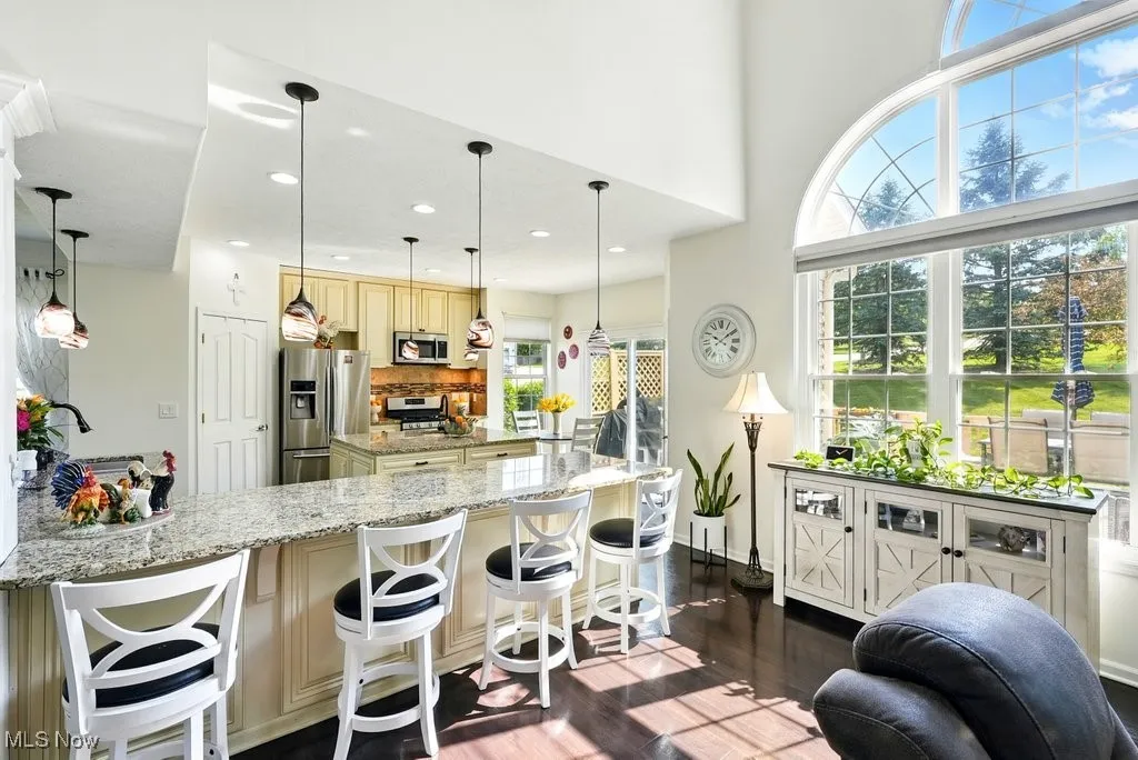 Kitchen with Granite Countertops, Large island, Updated Appliances, and 2 Pantries