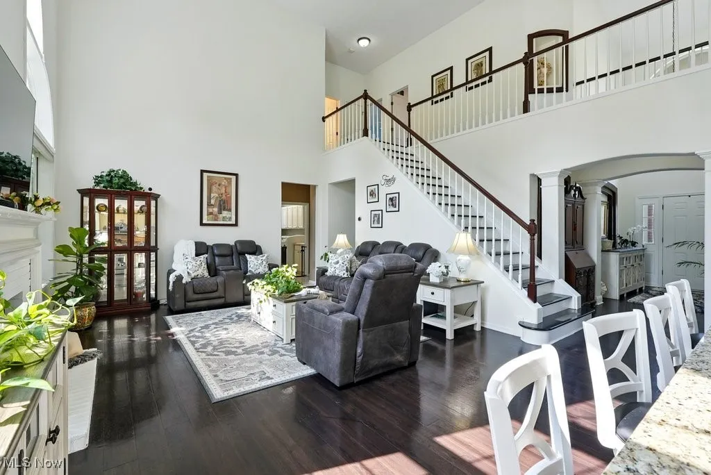 Great Room with Fireplace, Window Treatment, Gorgeous Large Window that Flanks Both Sides of Fireplace, and Two Story Ceiling Height