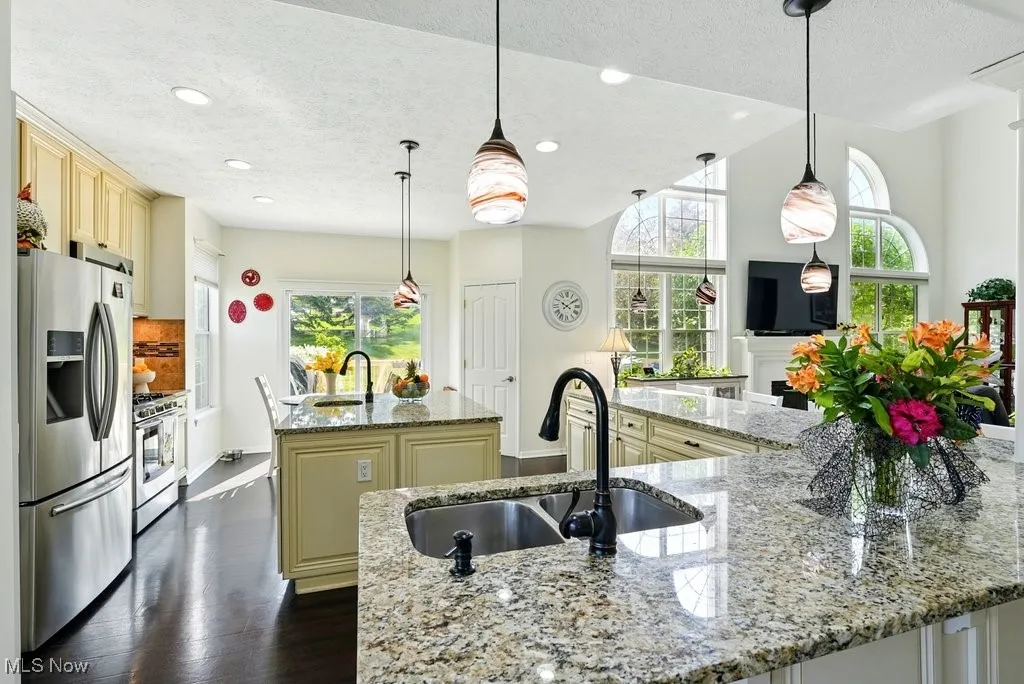 Kitchen with Granite Countertops, Large island, Updated Appliances, and 2 Pantries