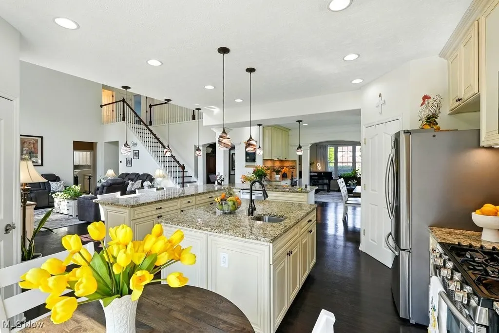 Kitchen with Granite Countertops, Large island, Updated Appliances, and 2 Pantries