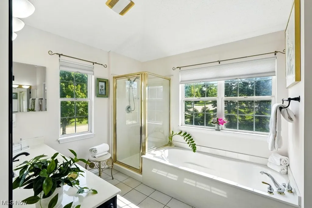 Master Bathroom with Two Separate  Closets, Separate Walk-In shower, and Soaking Tub