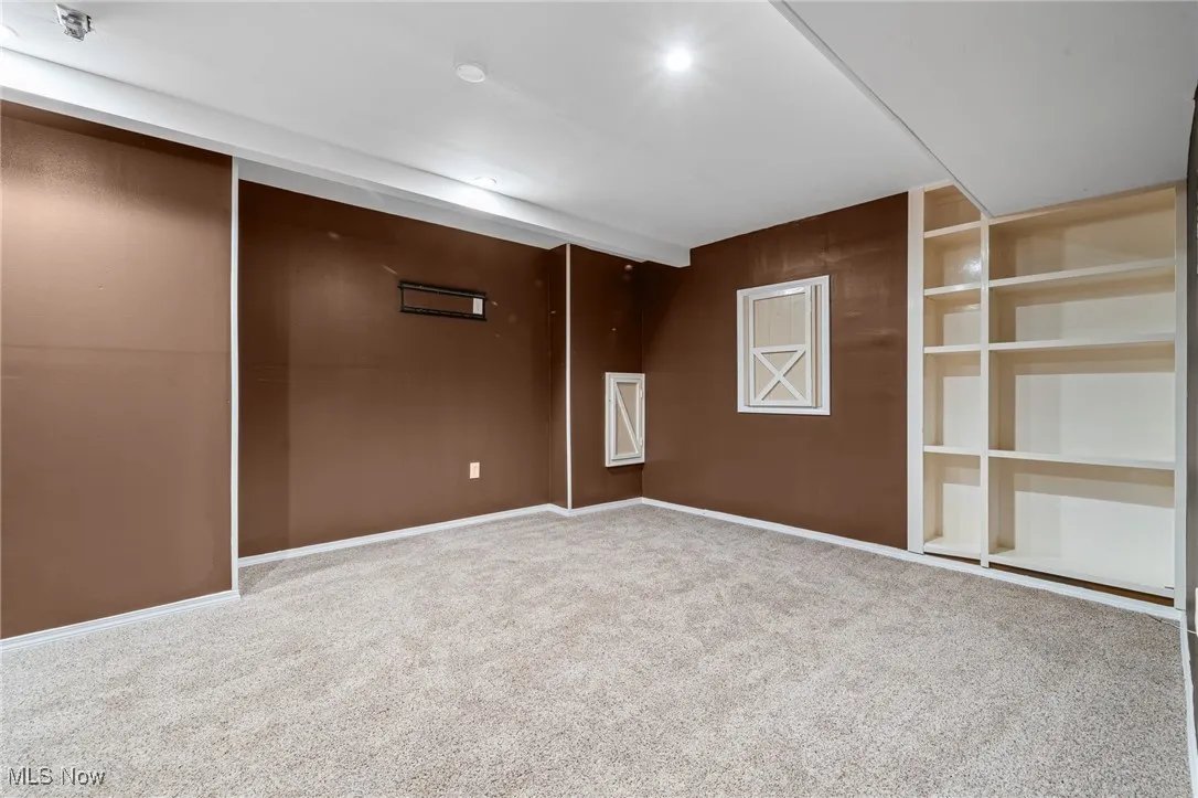 Unfurnished room featuring carpet flooring and baseboards