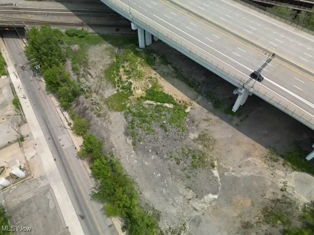 Aerial view of property's location with a main thoroughfare