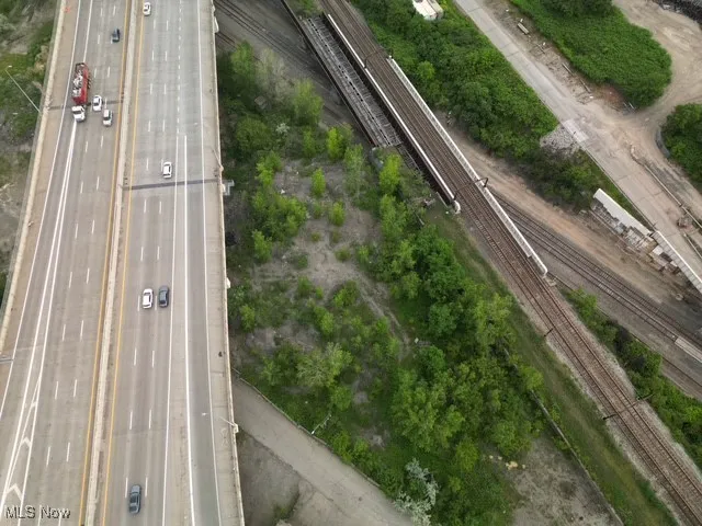 Aerial overview of property's location with a major roadway