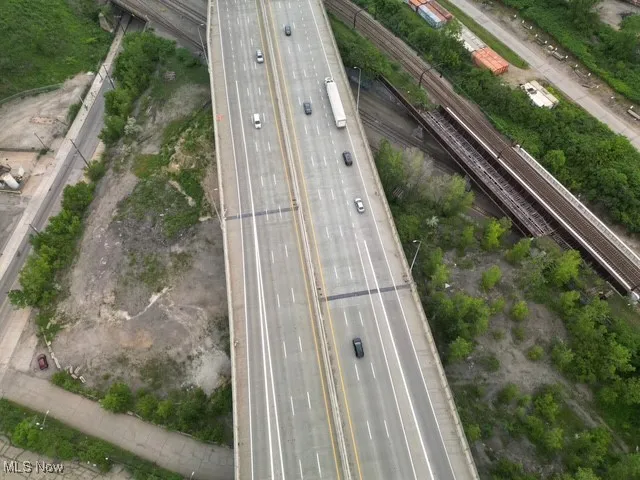 Aerial overview of property's location with a major roadway