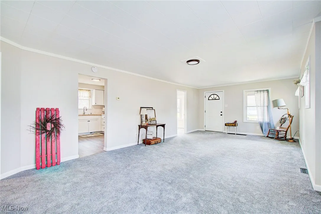 First closest door to the left leads to the kitchen, second door leads to the dining room/3rd bedroom/office.