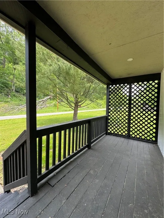 Deck featuring a yard