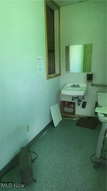 Bathroom with toilet and a sink