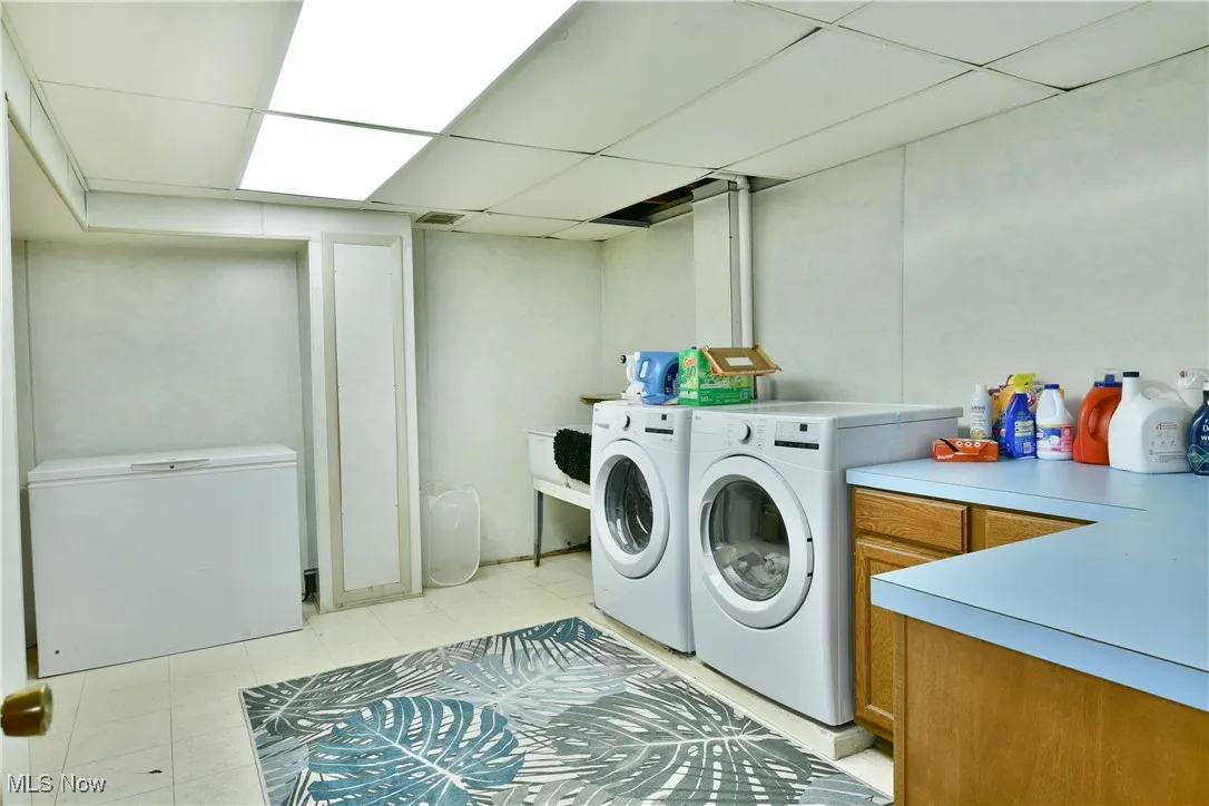 Laundry area with washing machine and clothes dryer