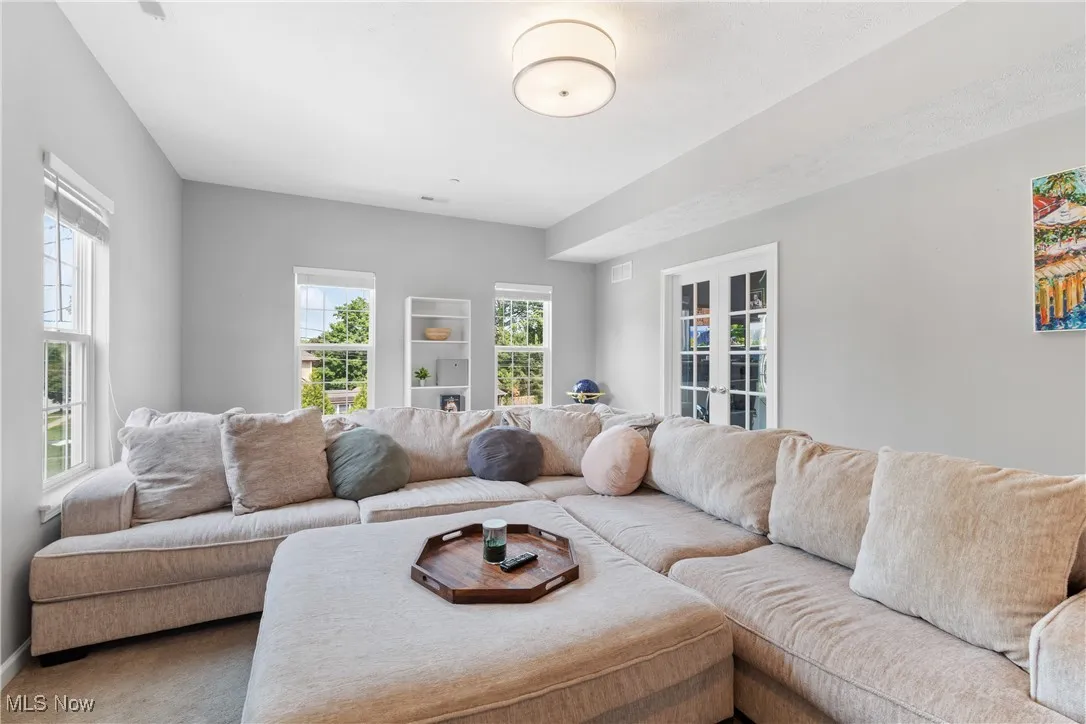 french doors in back of living room connect the office