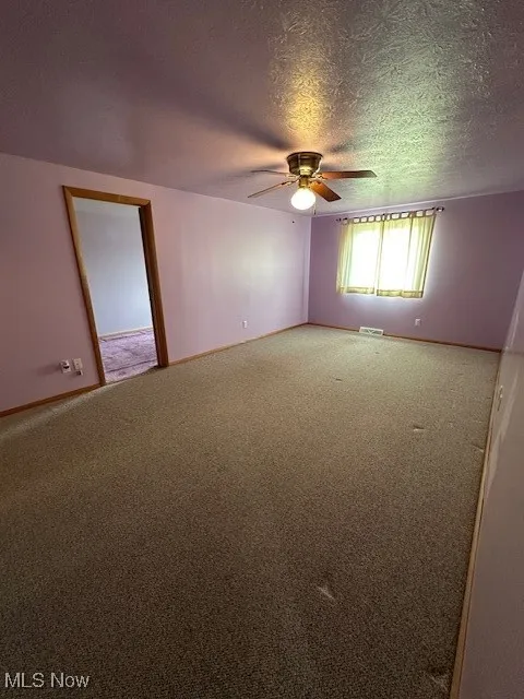 Master Bdr Carpeted featuring ceiling fan