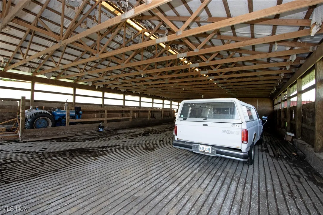 Garage featuring a carport